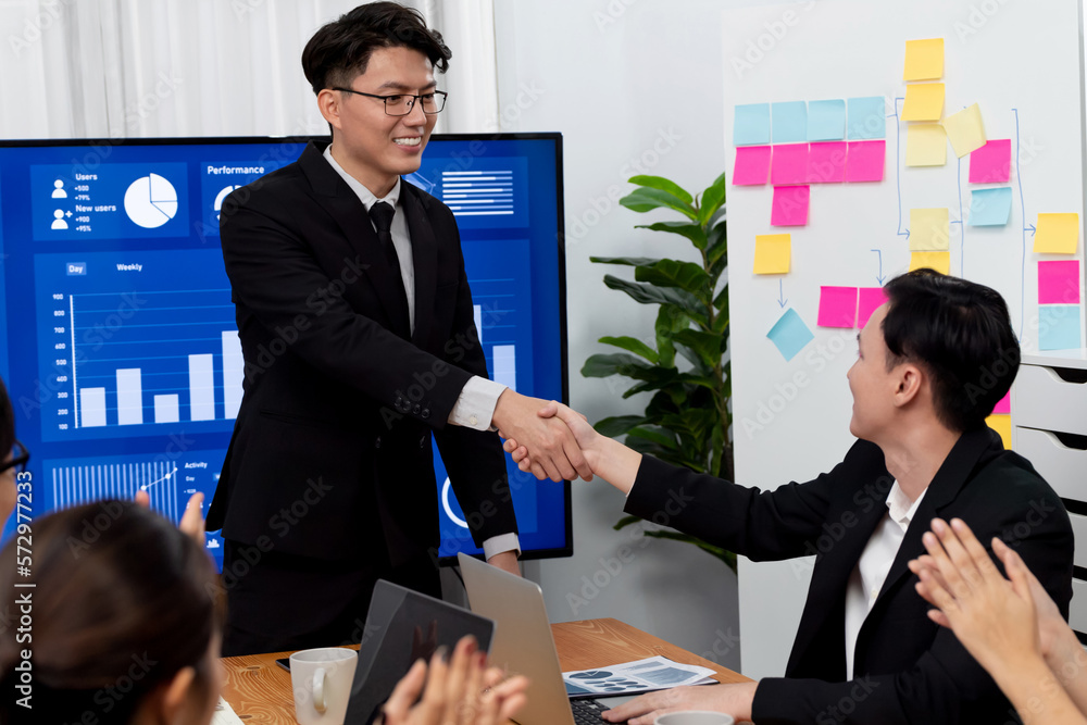 Businesspeople shake hand after successful agreement or meeting. Office worker colleague handshake w