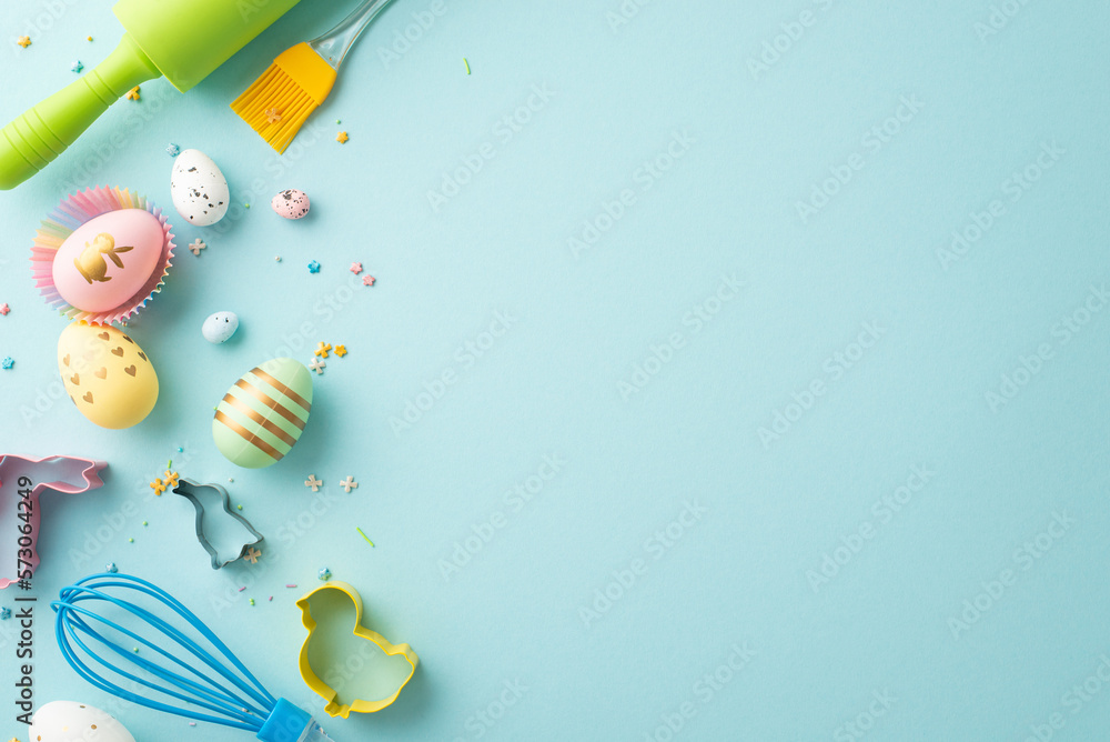 Easter concept. Top view photo of colorful easter eggs in paper baking molds rolling-pin whisk brush