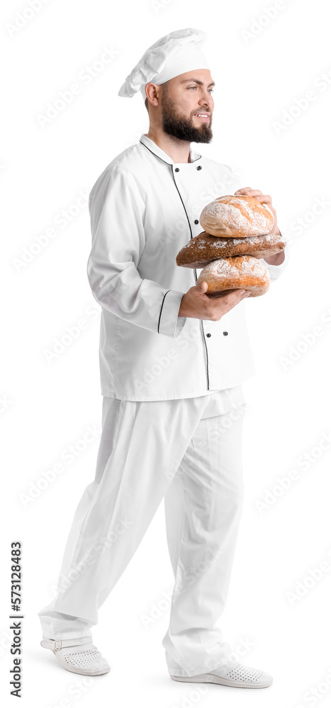 Male baker with loaves of fresh bread on white background