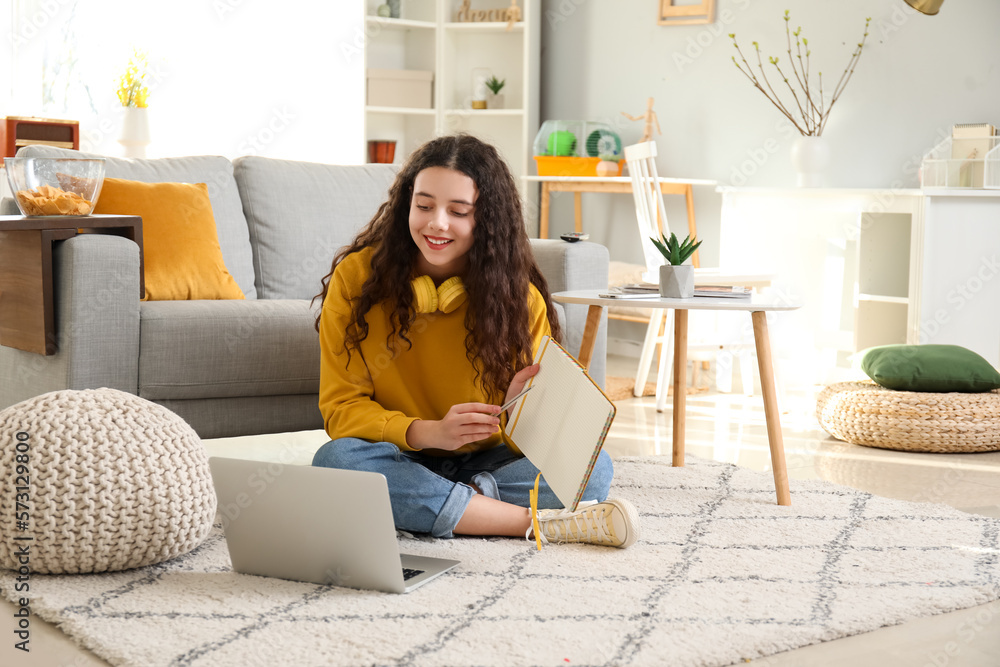 Female student doing homework at home