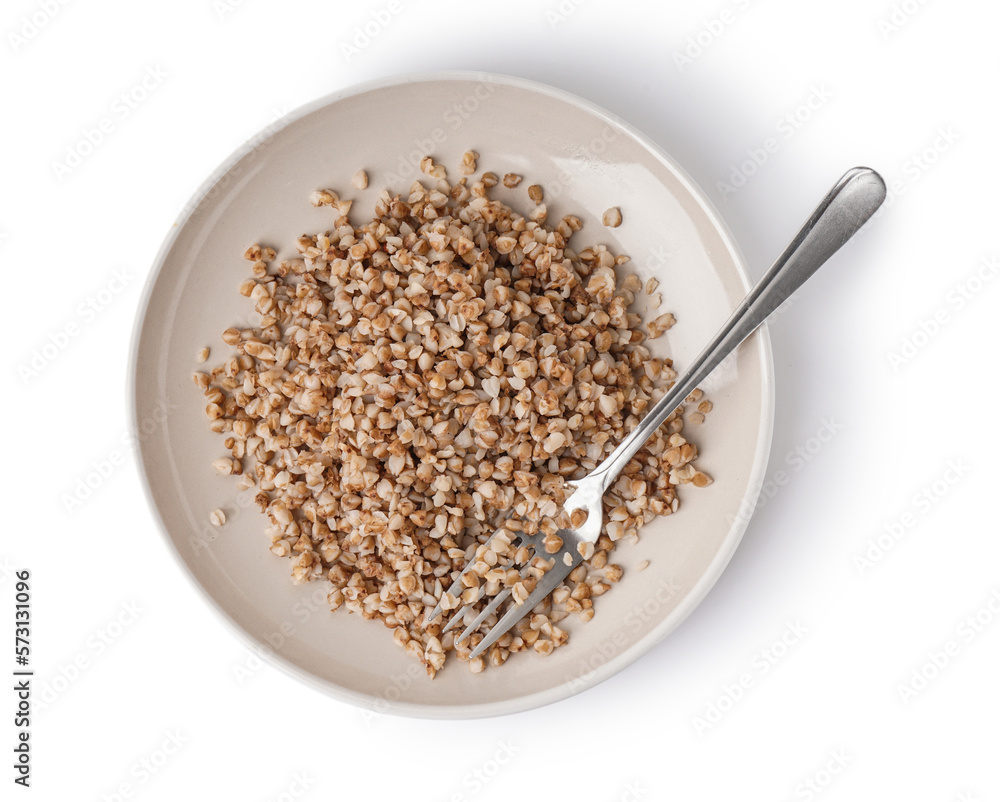 Plate of tasty buckwheat porridge isolated on white background