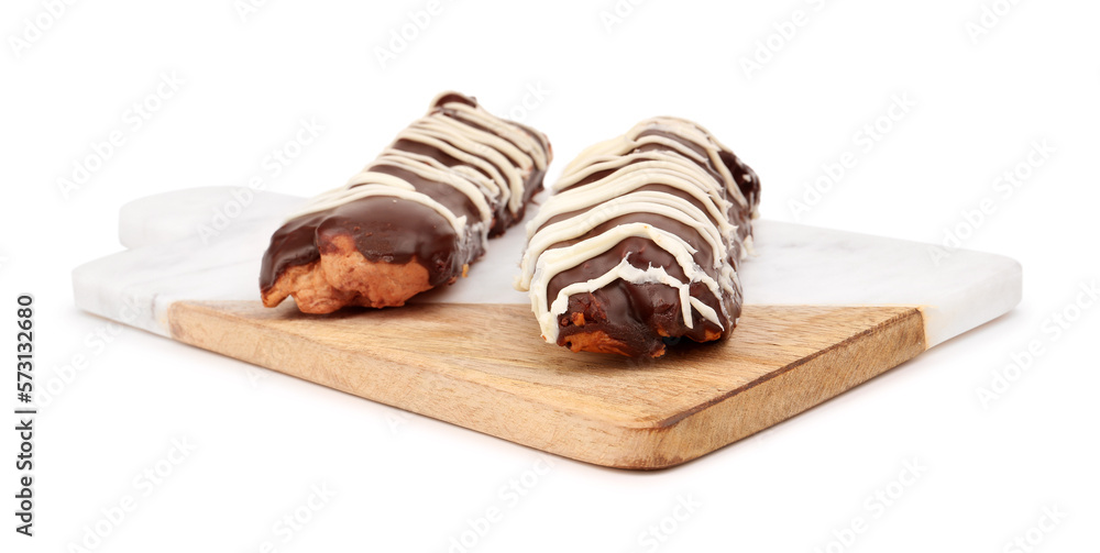 Board with sweet chocolate eclairs isolated on white background