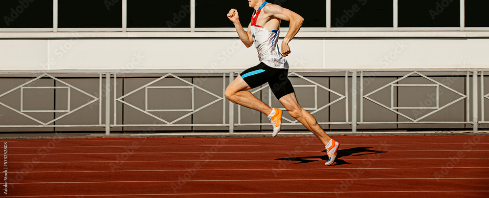 male runner sprinter run on track stadium in athletics