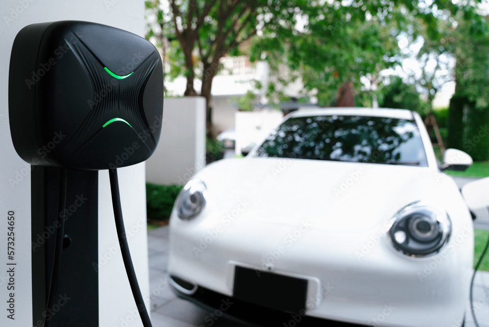 Focus electric home charging station powered from green energy at home for vehicle engine. Progressi