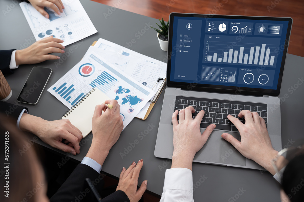 Closeup on meeting desk with businesspeople analyzing business marketing strategy with hands working