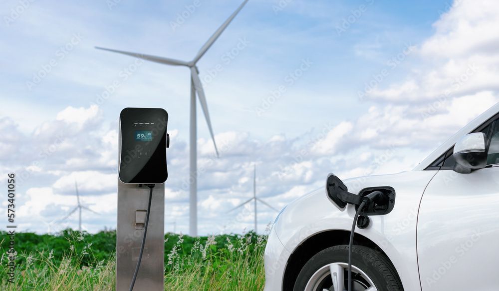 Progressive combination of wind turbine and EV car, future energy infrastructure. Electric vehicle b