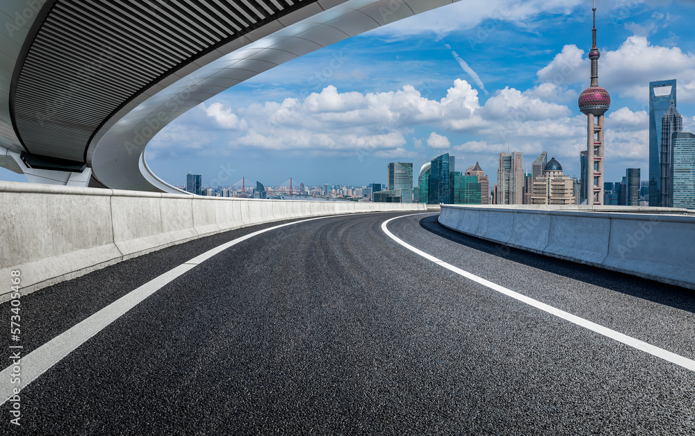 Asphalt road and bridge with city skyline scenery in Shanghai, China.