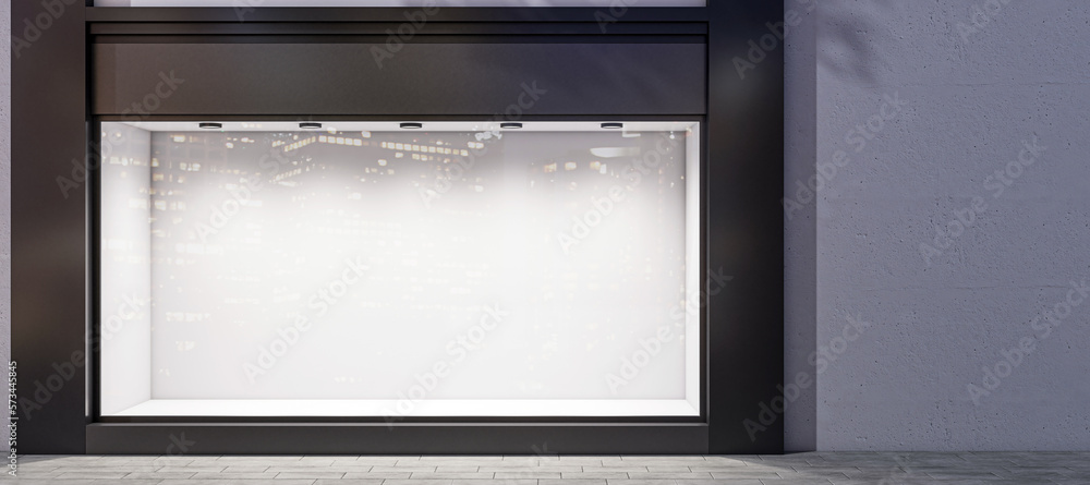 Front view on dark wall background with place for your advertising poster near empty shop window wit