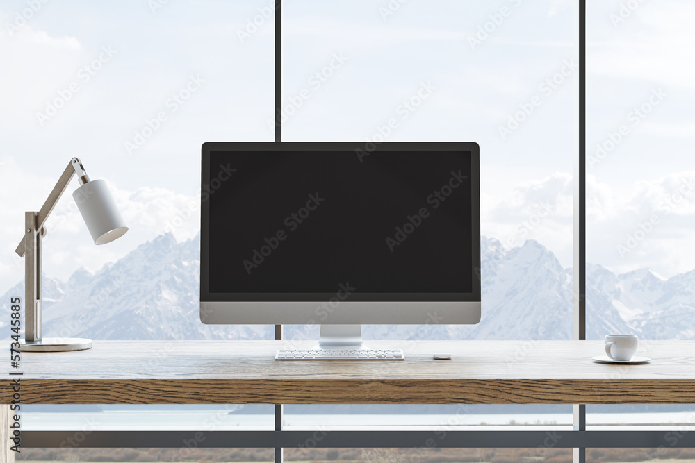 Front view on blank black modern computer monitor with space for your logo or text on wooden work su