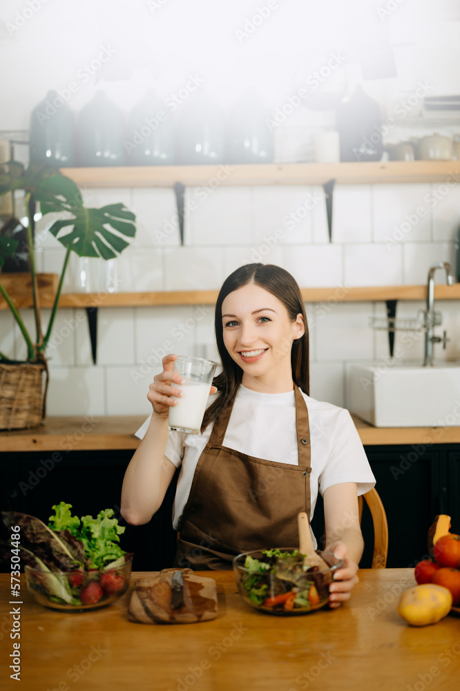 image of asian woman preparing salad in the kitchen and healthy  food in bowl e