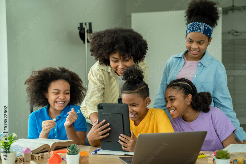 African american elementary school children using digital tablet computer learning online education 