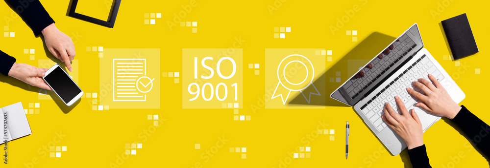 ISO 9001 concept with two people working together