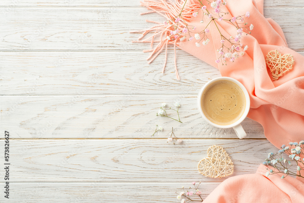 Hello spring concept. Top view photo of cup of fresh coffee rattan hearts gypsophila flowers and pin