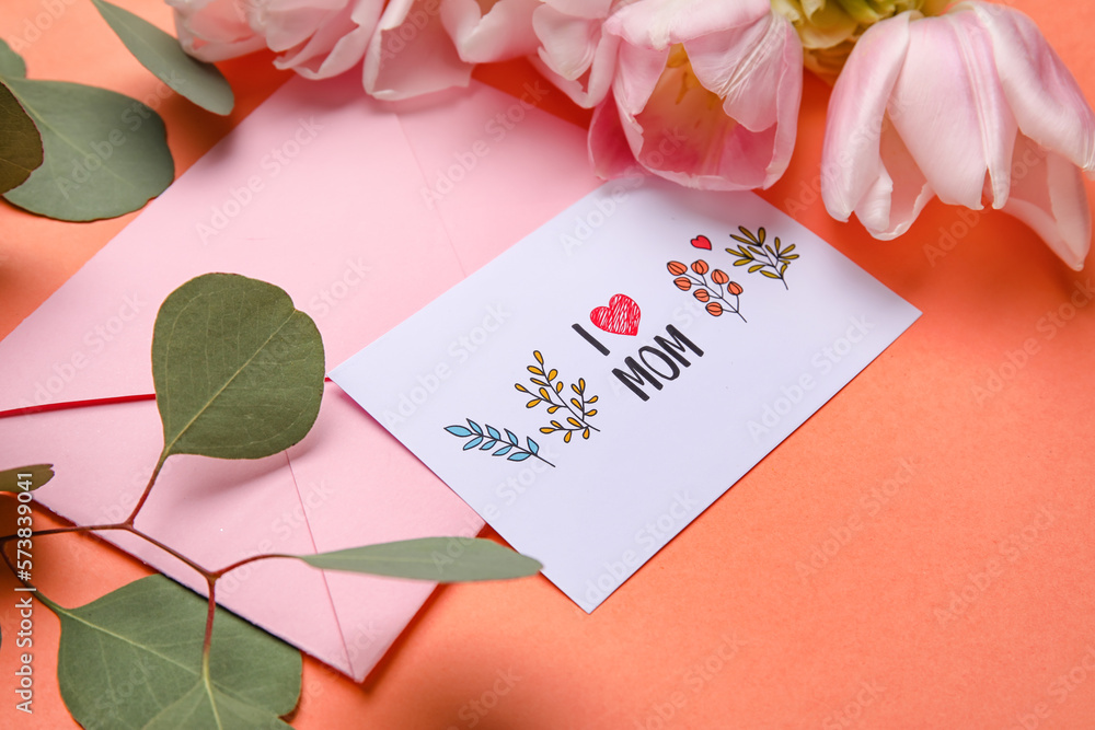 Composition with greeting card, eucalyptus branch and flowers on color background, closeup. Mothers