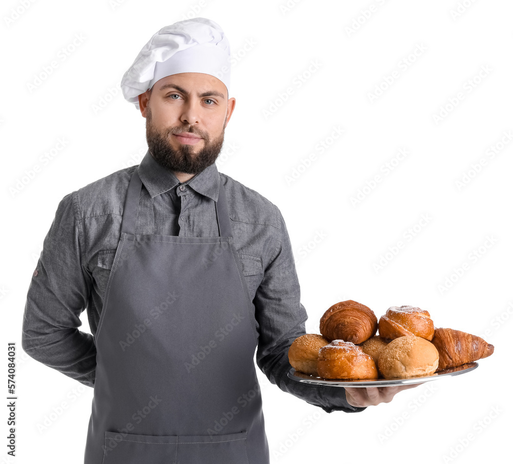 Male baker holding tray with pastries on white background