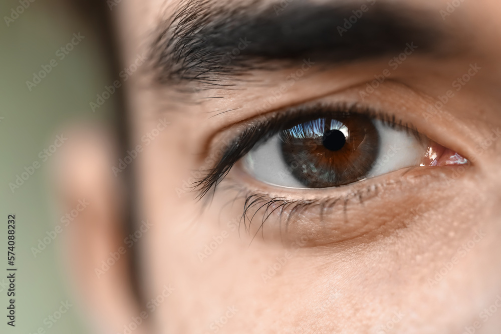 Young man with brown eyes, closeup