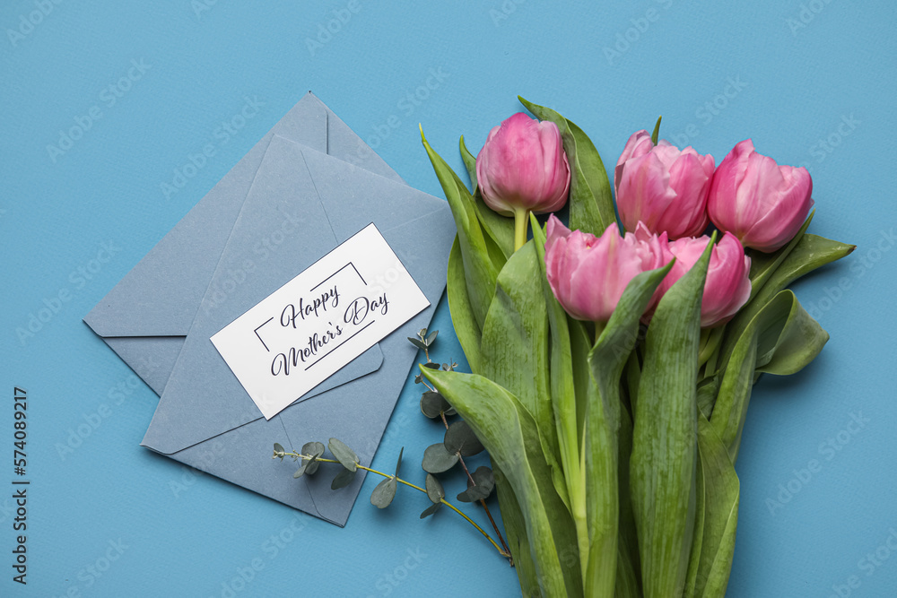 Composition with greeting card, envelopes and beautiful tulip flowers on color background. Mothers 