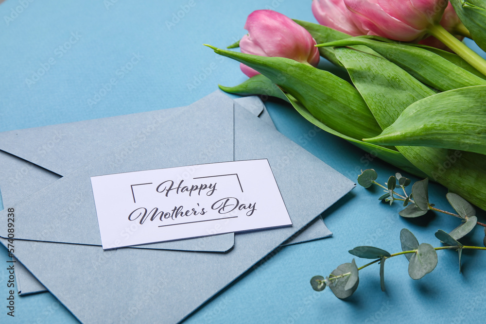 Composition with greeting card, envelopes and beautiful tulip flowers on color background, closeup. 