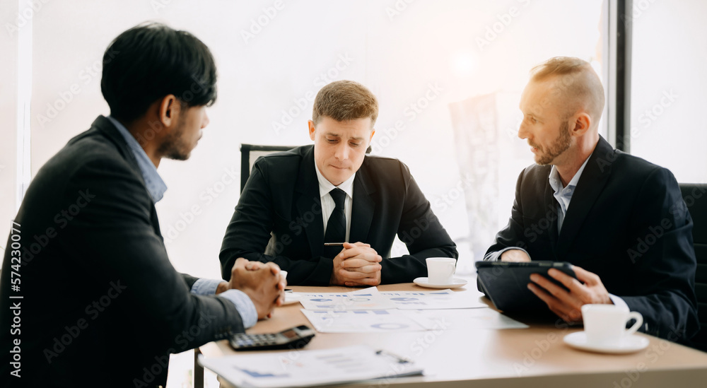 Business team discuss at meeting room. working together with laptop ,tablet and smart phone on desk 