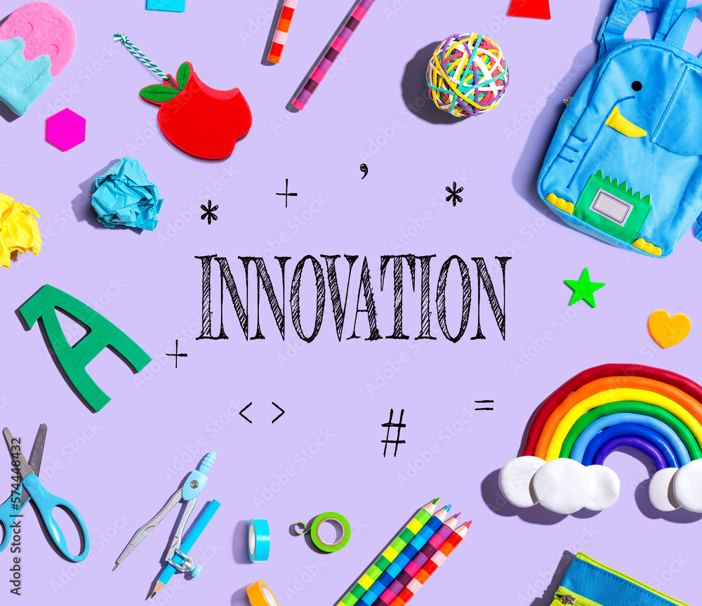 Innovation theme with school supplies on a purple background - flat lay