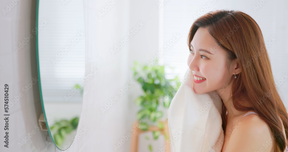 woman clean face by towel