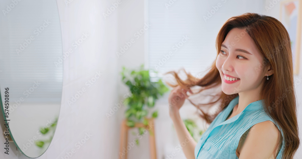 woman is looking in mirror