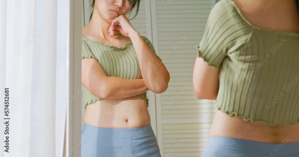 woman dissatisfied about body shape