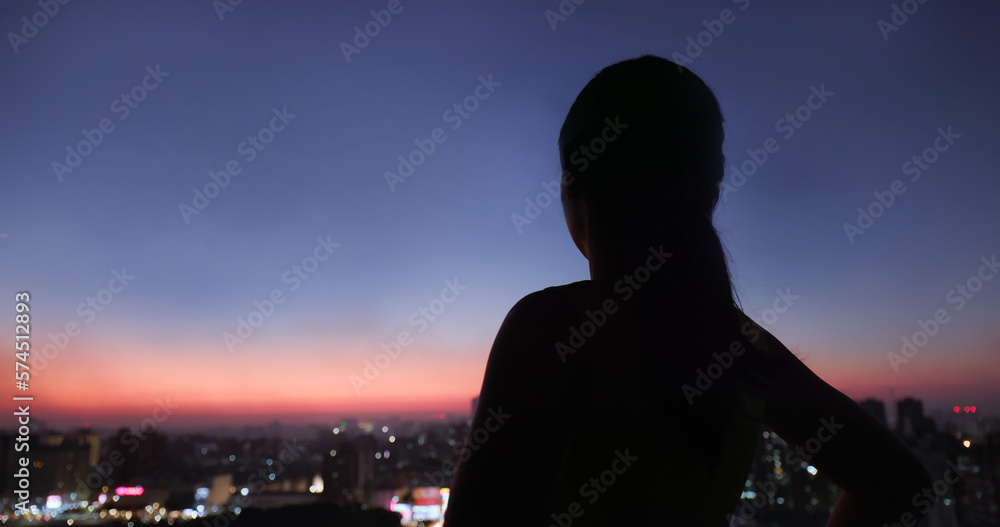 woman with night city view