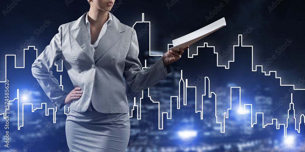 Woman architect or engineer presenting construction concept and holding documents in hand