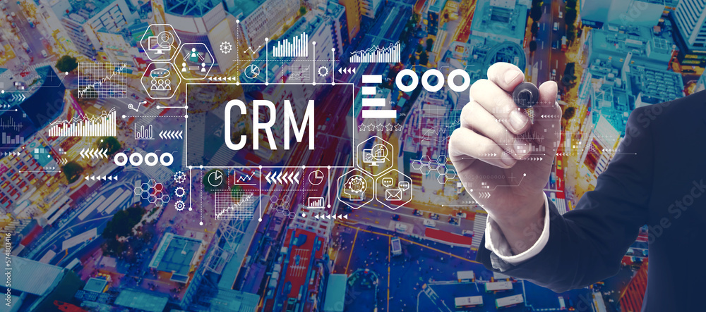 CRM - Customer Relationship Management theme with businessman in a city at night