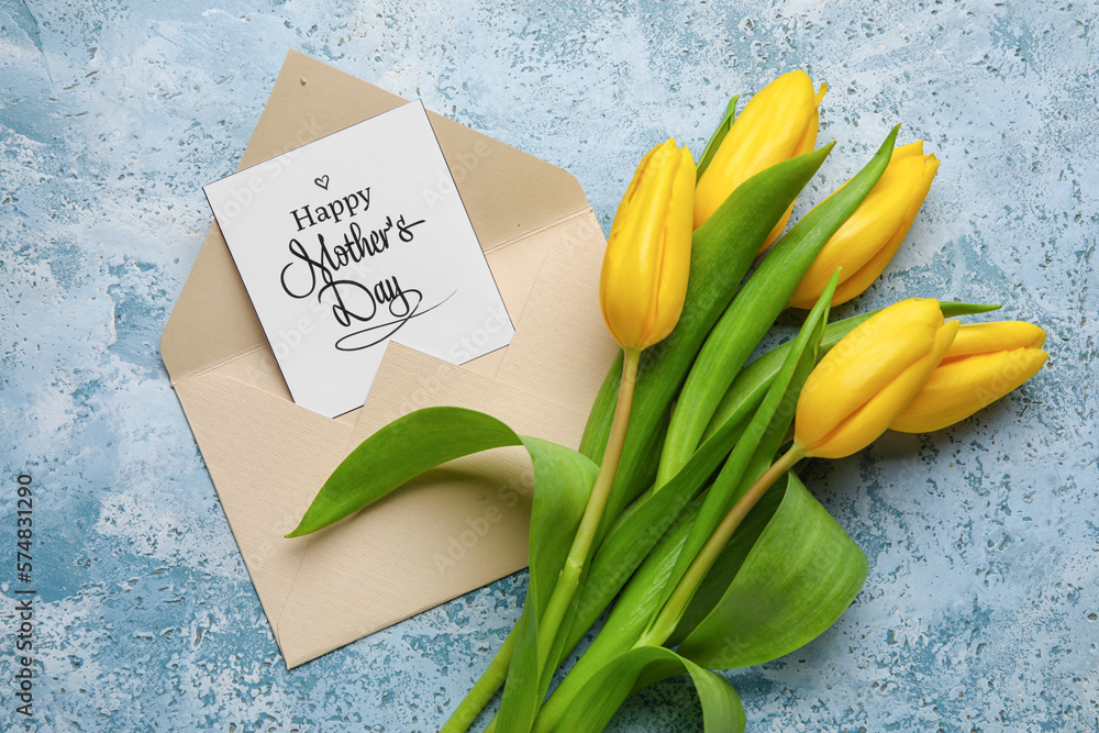 Card with text HAPPY MOTHERS DAY, envelope and beautiful tulip flowers on color background