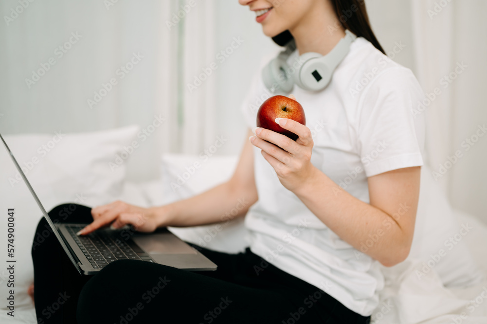 Good Healthy woman drinking tea and resting in white bed at bedroom. Lifestyle at home concept in mo