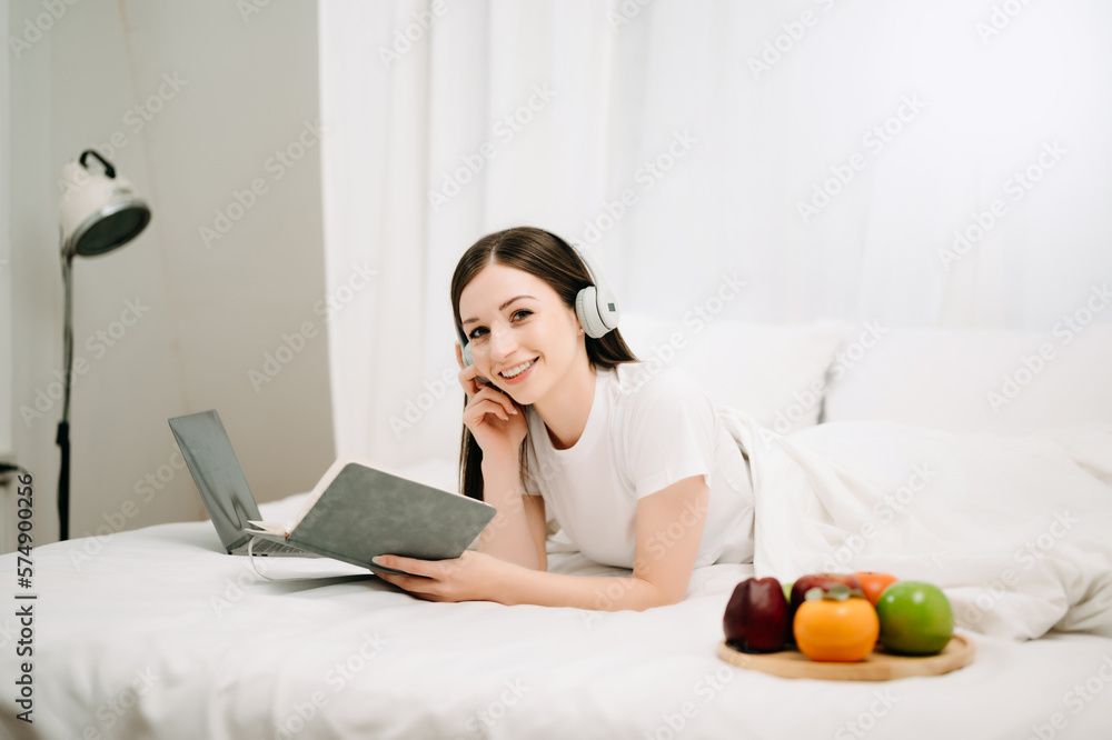 Portrait of Good Healthy young woman reading book and resting in bed at bedroom. lifestyle concept.