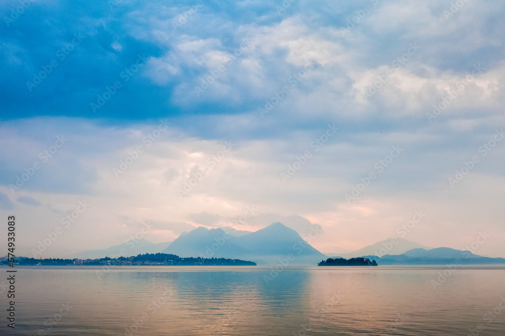 Mountain lake shore and hills in Italy