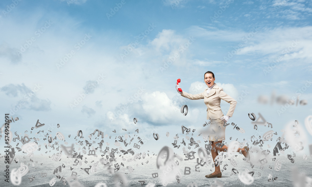 Woman running outdoor with vintage red phone