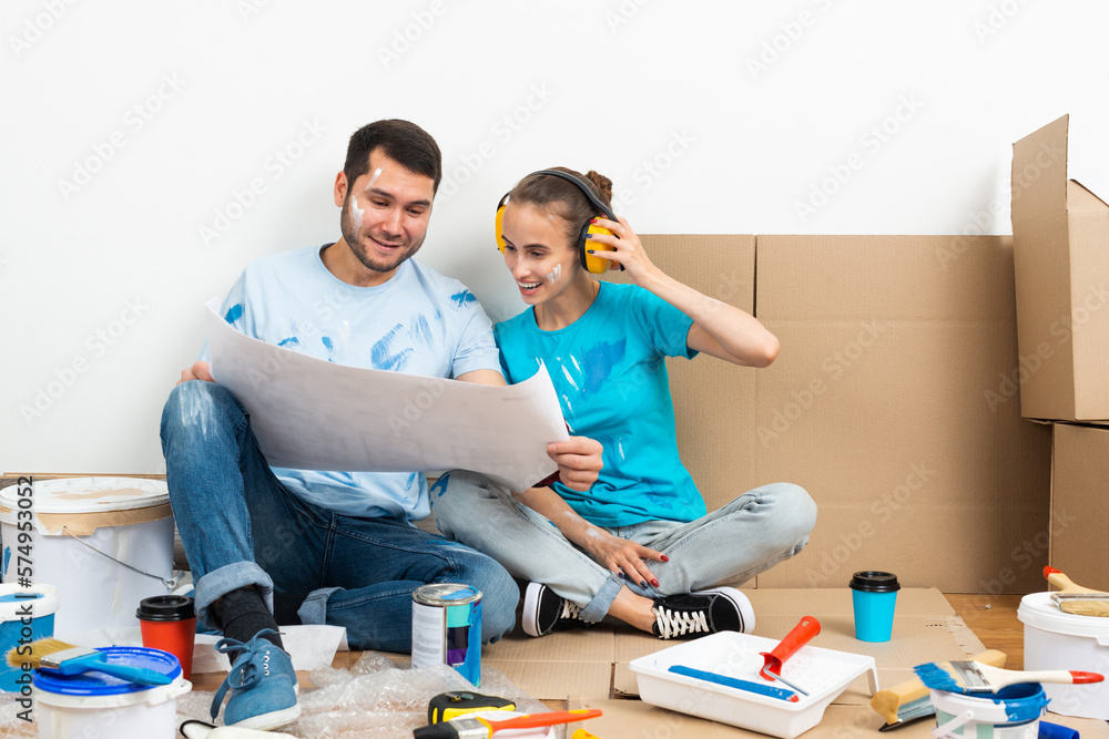 Happy boy and girl in protective headphones