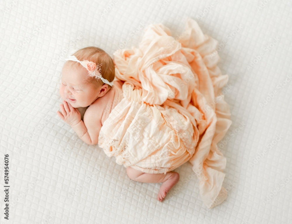 Cute newborn baby girl studio portrait