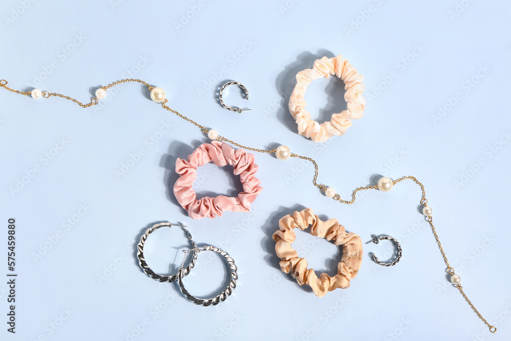 Composition with beautiful accessories and scrunchies on color background