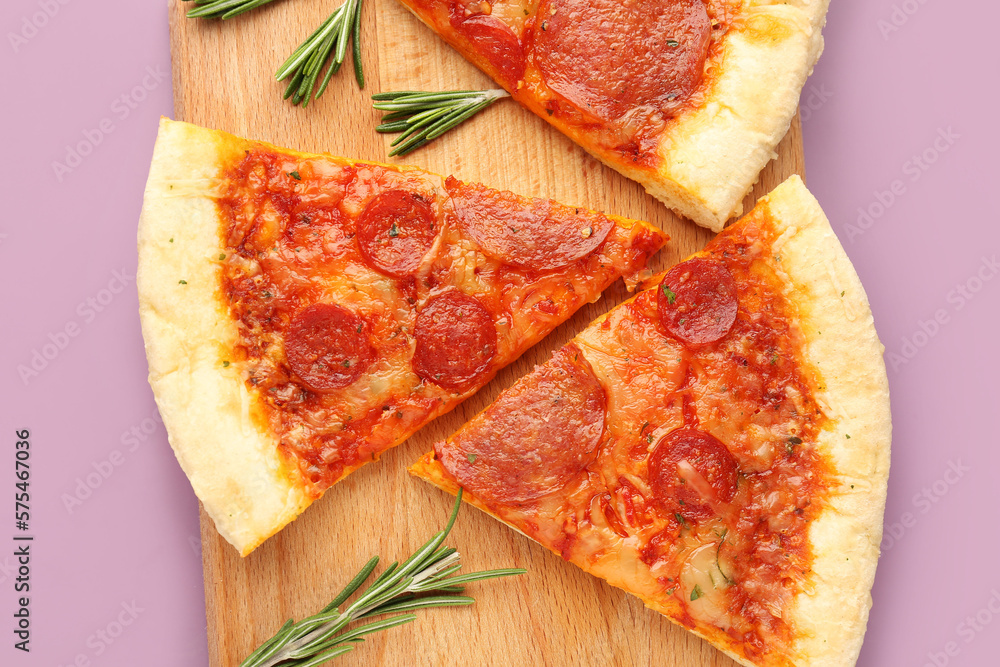 Board with slices of delicious pepperoni pizza and rosemary on lilac background