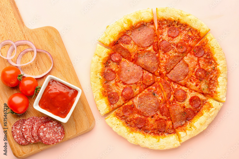 Delicious pepperoni pizza and board with ingredients on pink background