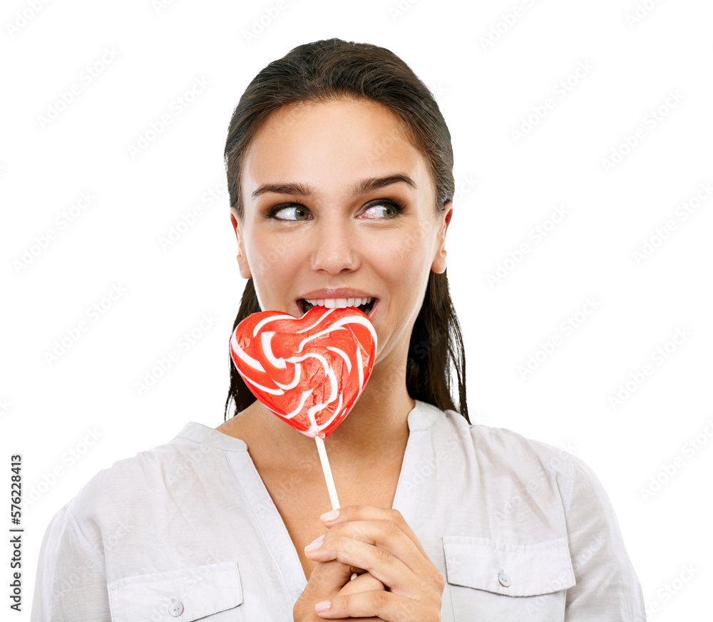 A happy young female model eating a heart-shaped sweet candy or a lollipop for her sweet cravings, d