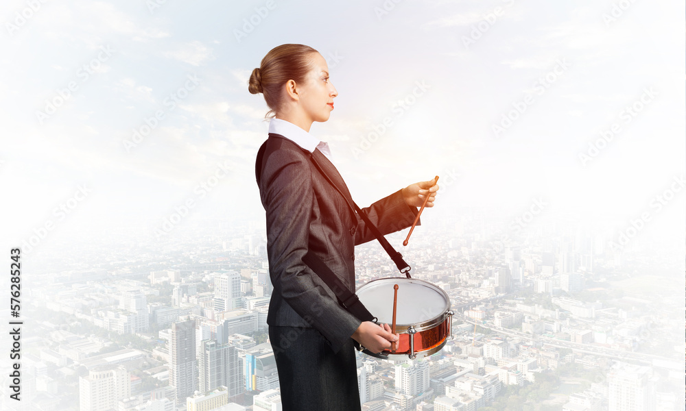 Young business woman with a drum