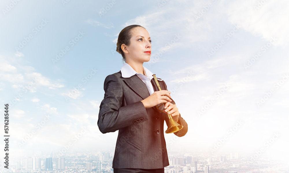 Business woman playing the trumpet