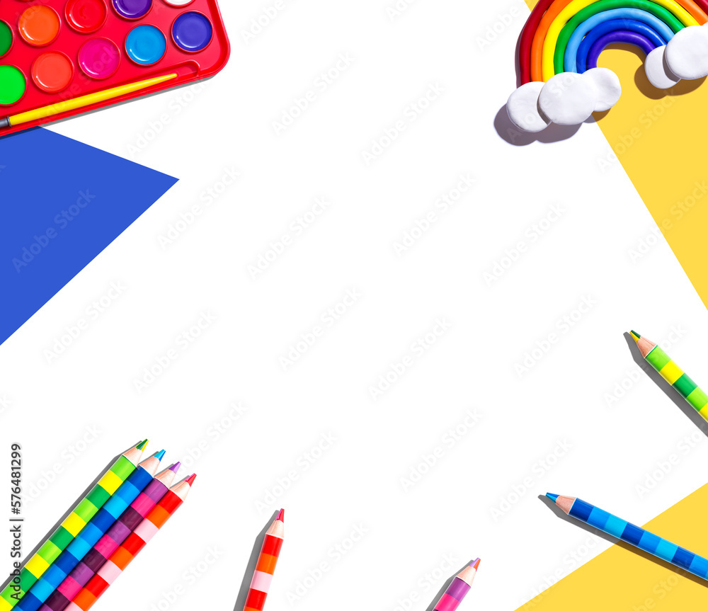 Art supplies with a rainbow - overhead view - flat lay