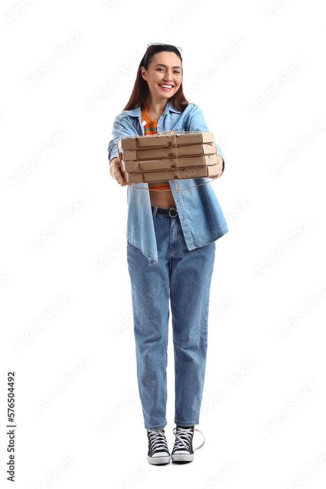 Young woman with cardboard boxes of pizza on white background