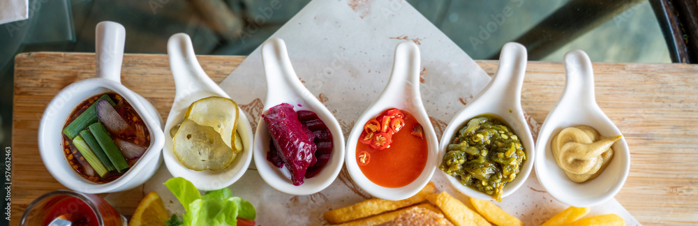 Bowl with sauce set isolated on the table