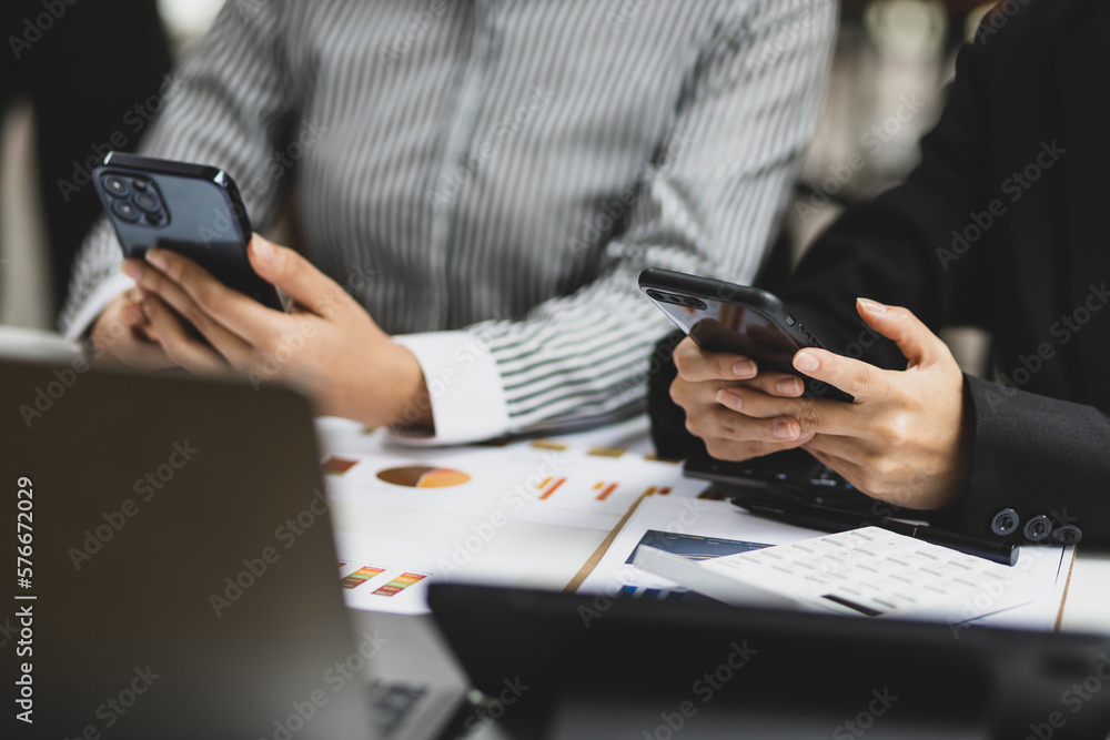 Businesswoman colleague working on modern smartphone, financial advisor, accounting, investment.