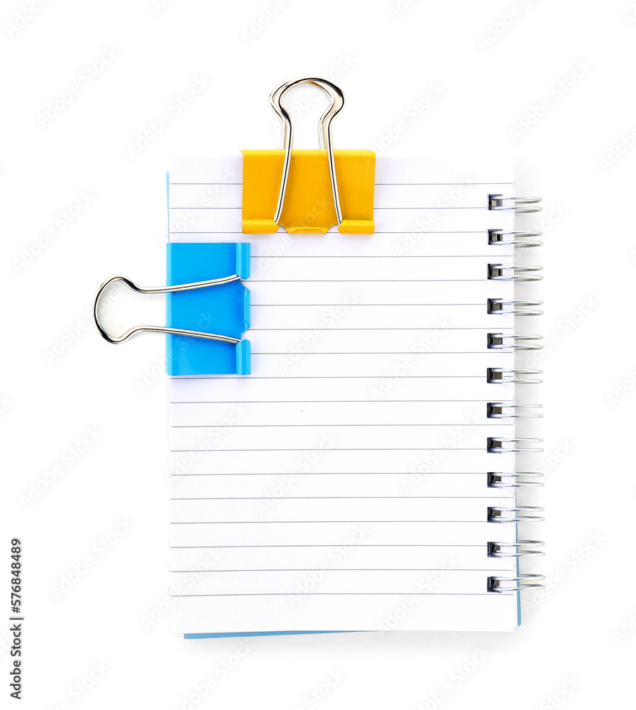 Notebook with binder clips on white background