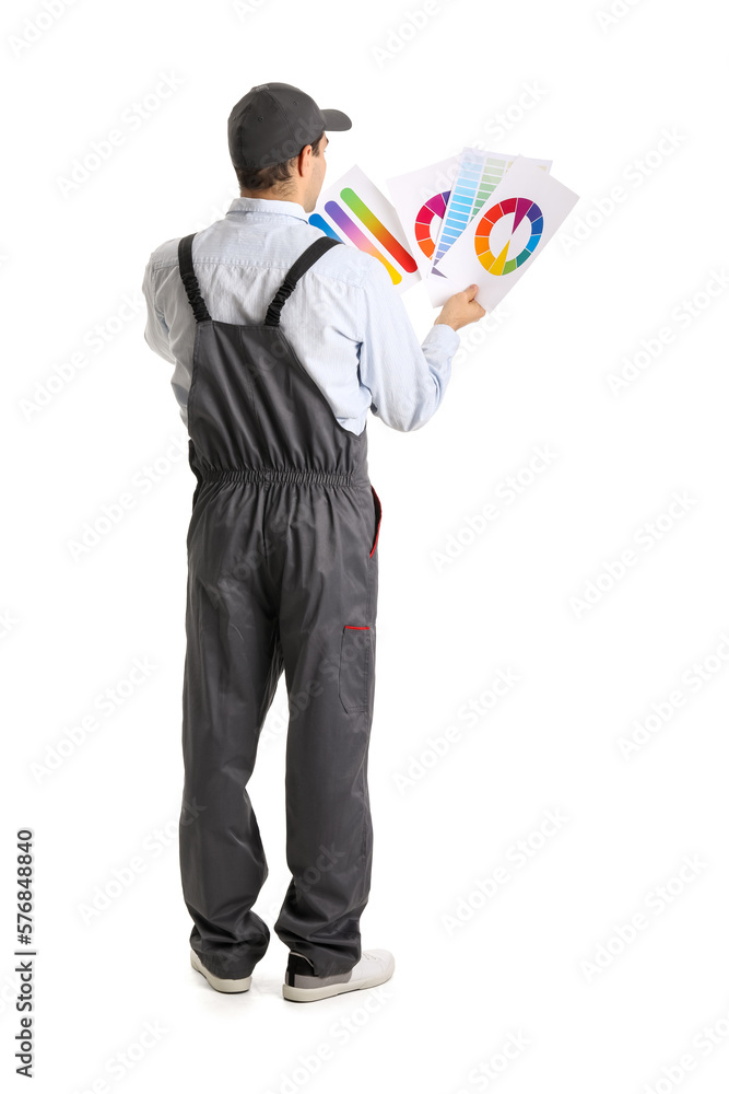 Male painter with color palettes on white background, back view