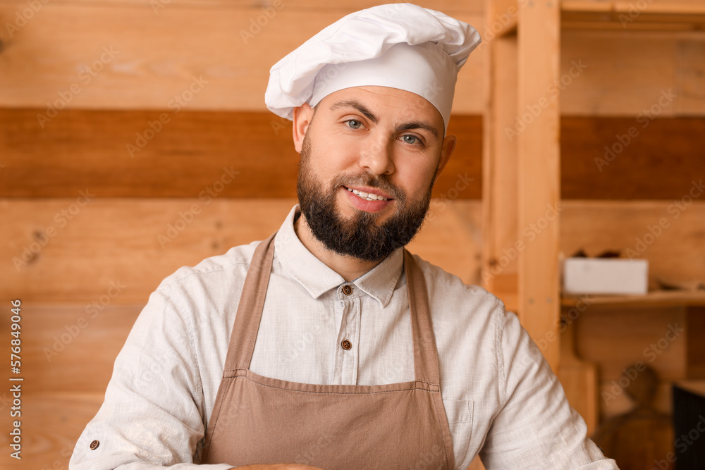 Male baker cooking in kitchen, closeup